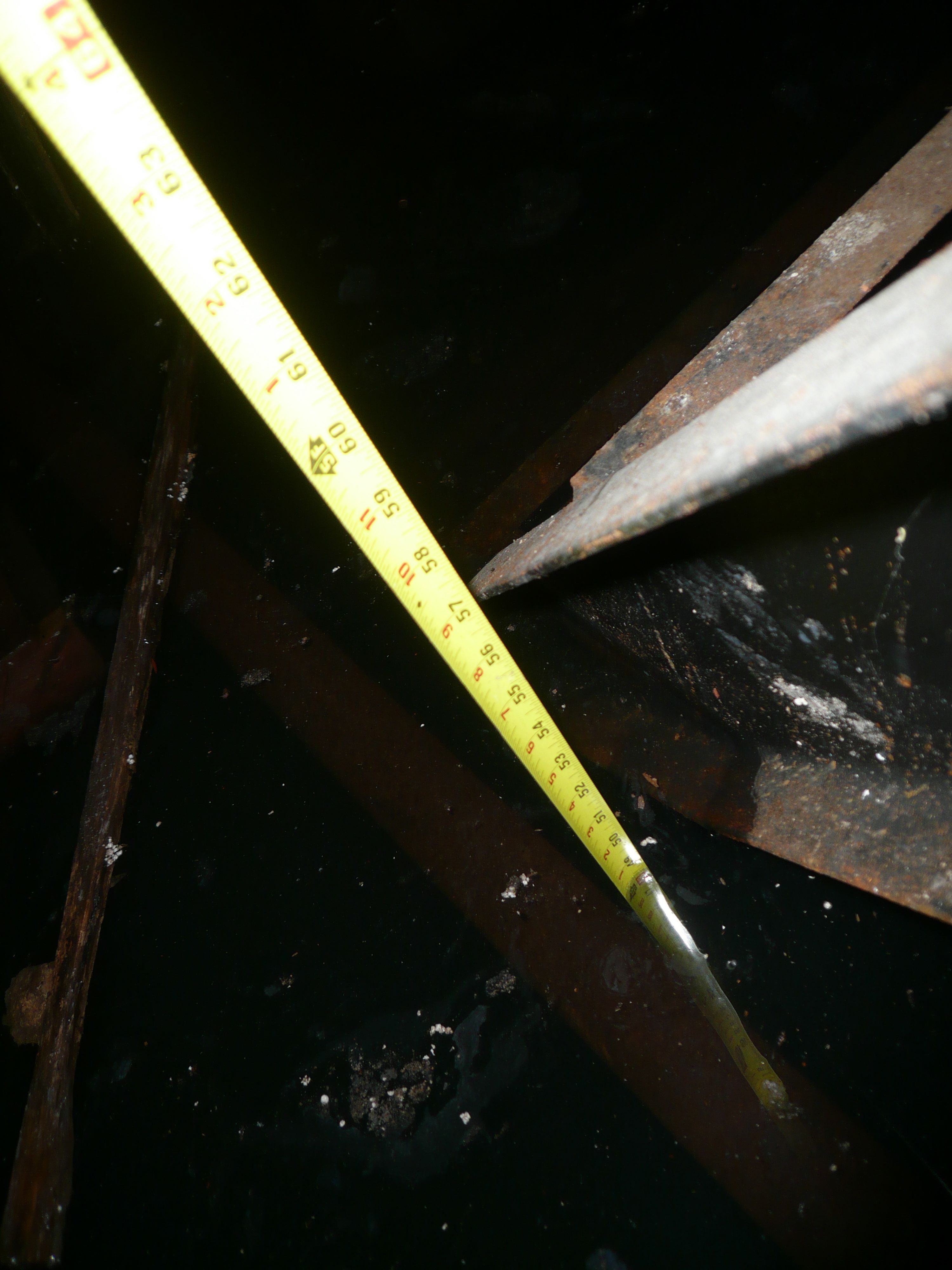 Plunged measuring tape to the basement floor through mirky water